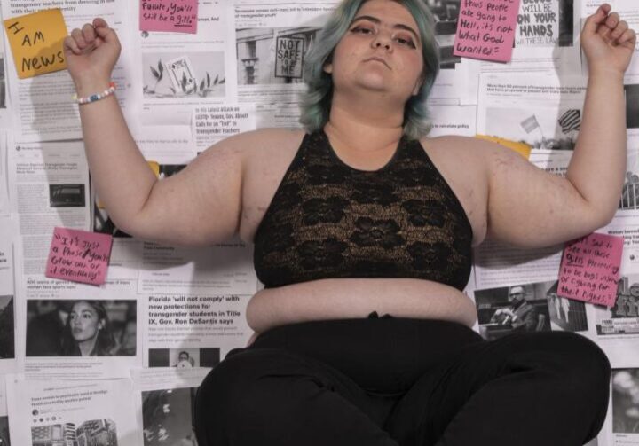 Individual surrounded by paper notes