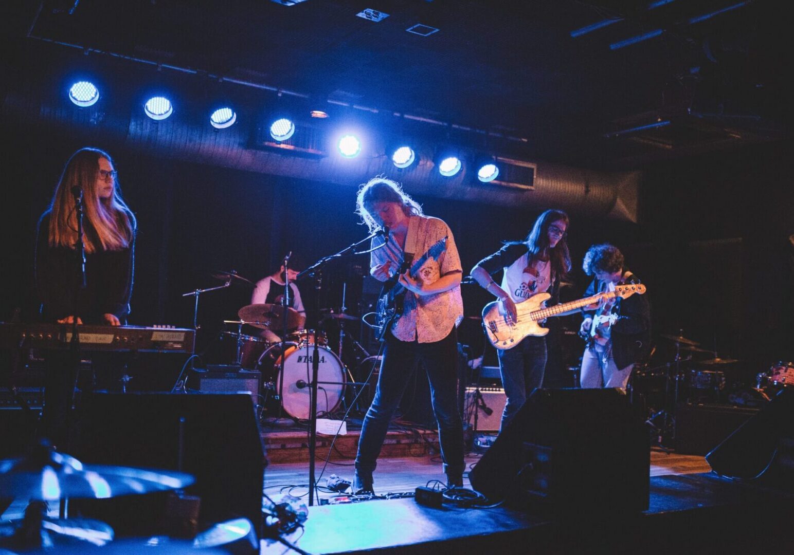 Concert with band members on stage