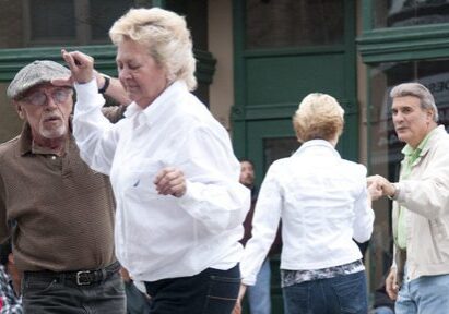 Group of seniors dancing outside