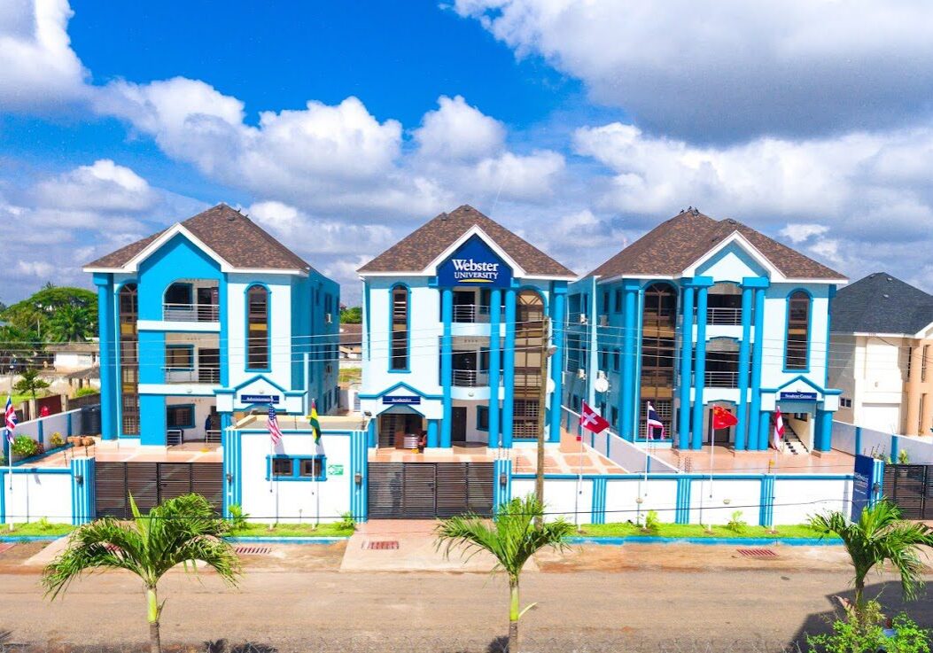 Blue and white building with flags