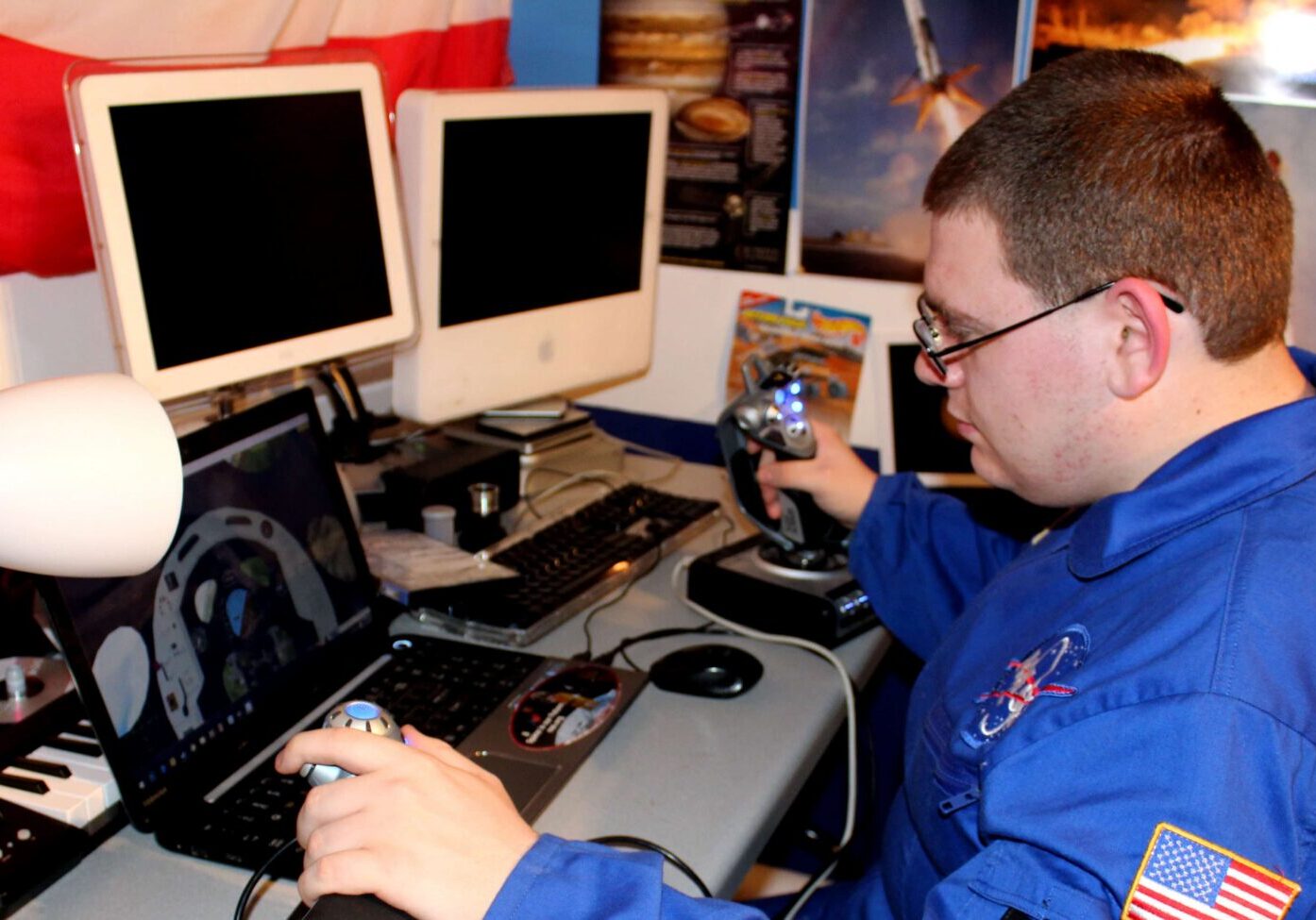 Person in space suit using flight simulator
