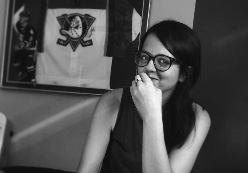 Person with glasses in black and white