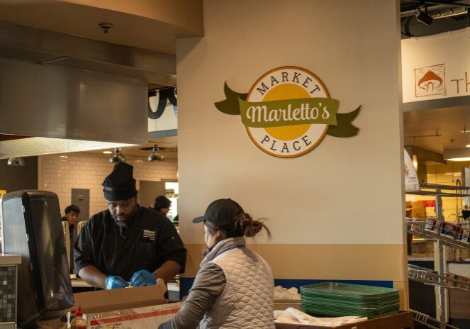 Chefs working in a cafeteria kitchen