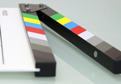 Movie scene clapperboard with color stripes