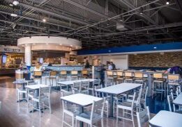 Empty modern cafeteria with tables and chairs