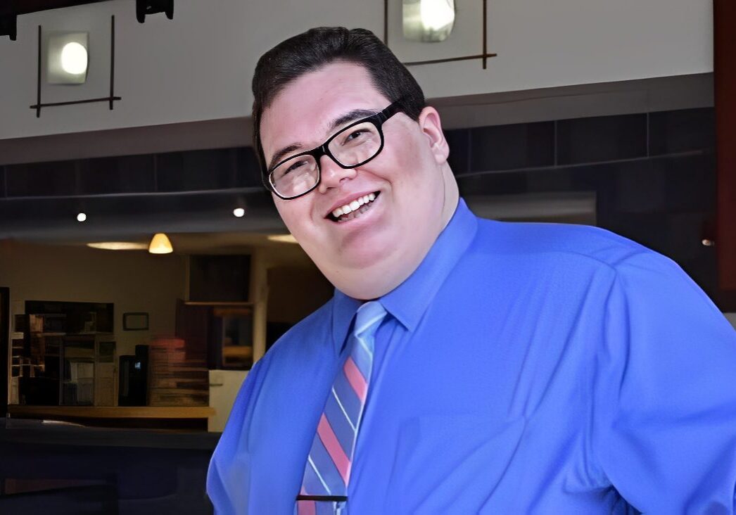 Happy individual at an indoor setting