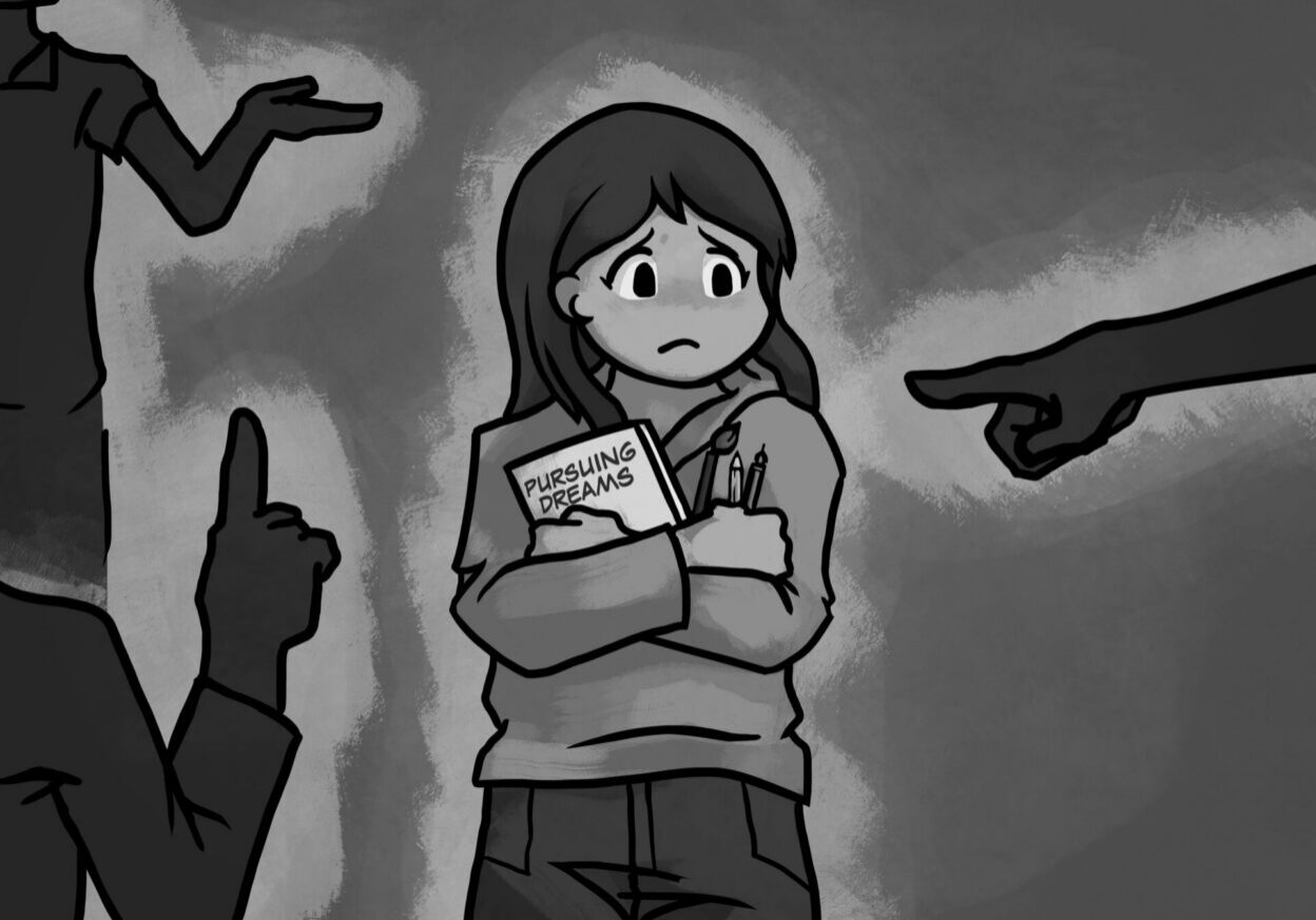 Girl clutching "Pursuing Dreams" book