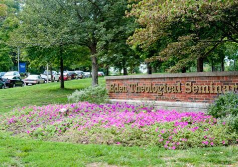 Flower bed near brick sign