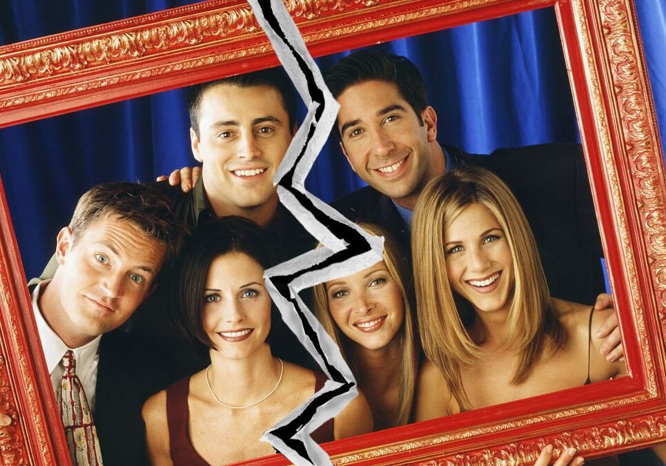 Friends posing behind cracked frame