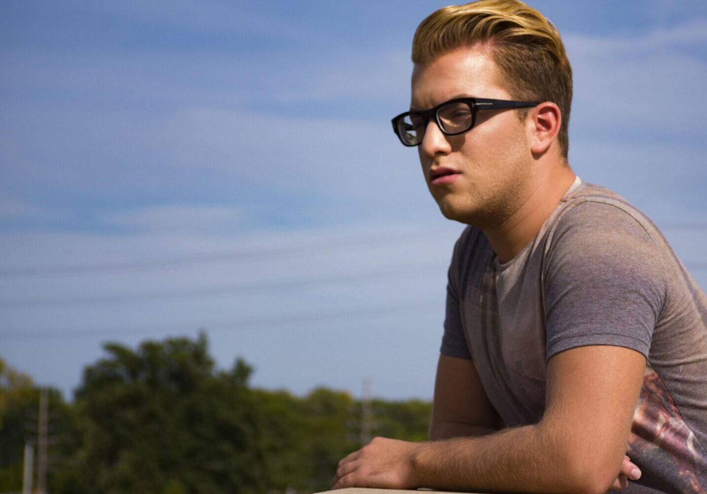 Individual in sunglasses enjoying sunny day
