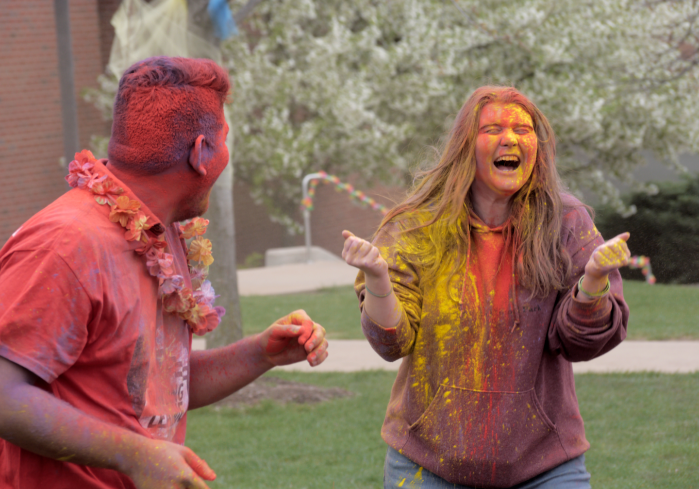 Friends enjoying Holi festival with colors
