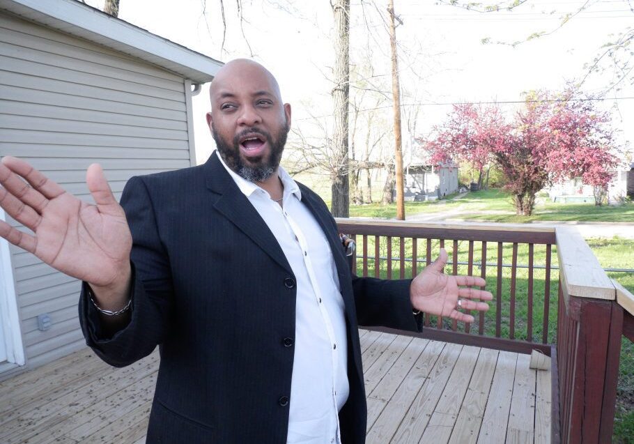 Man gesturing on wooden deck