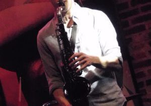 Saxophonist performing at live event