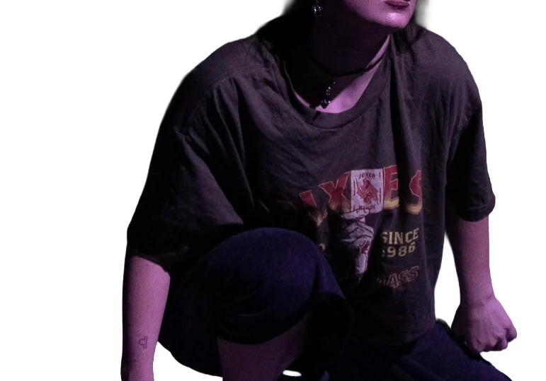 Pensive pose with purple lighting