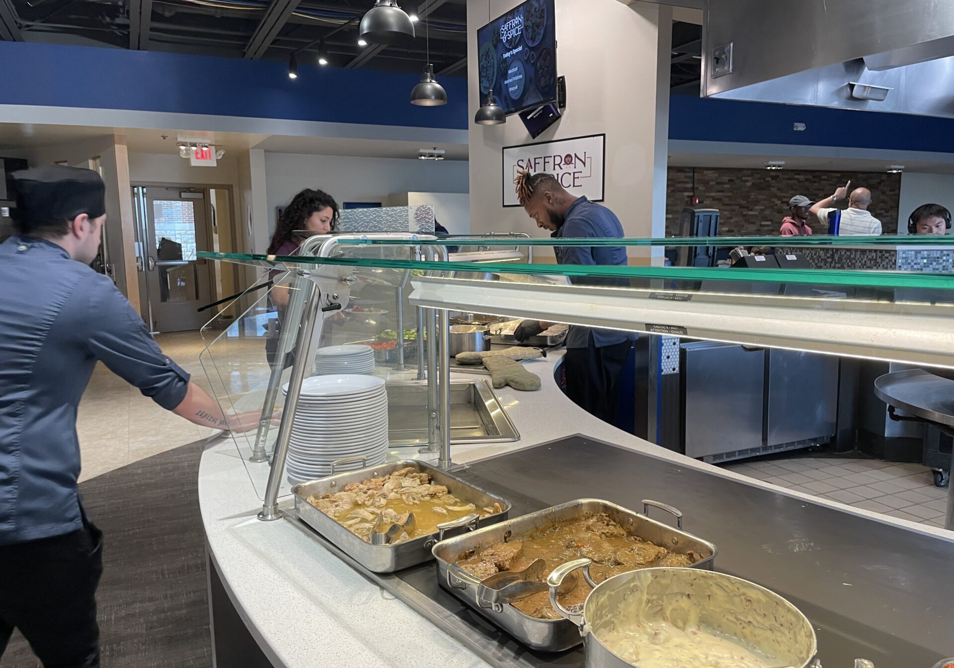 Saffron & Spice, a completely Halal dining option, serves food to a customer during lunch. Photo by Emma Sprung