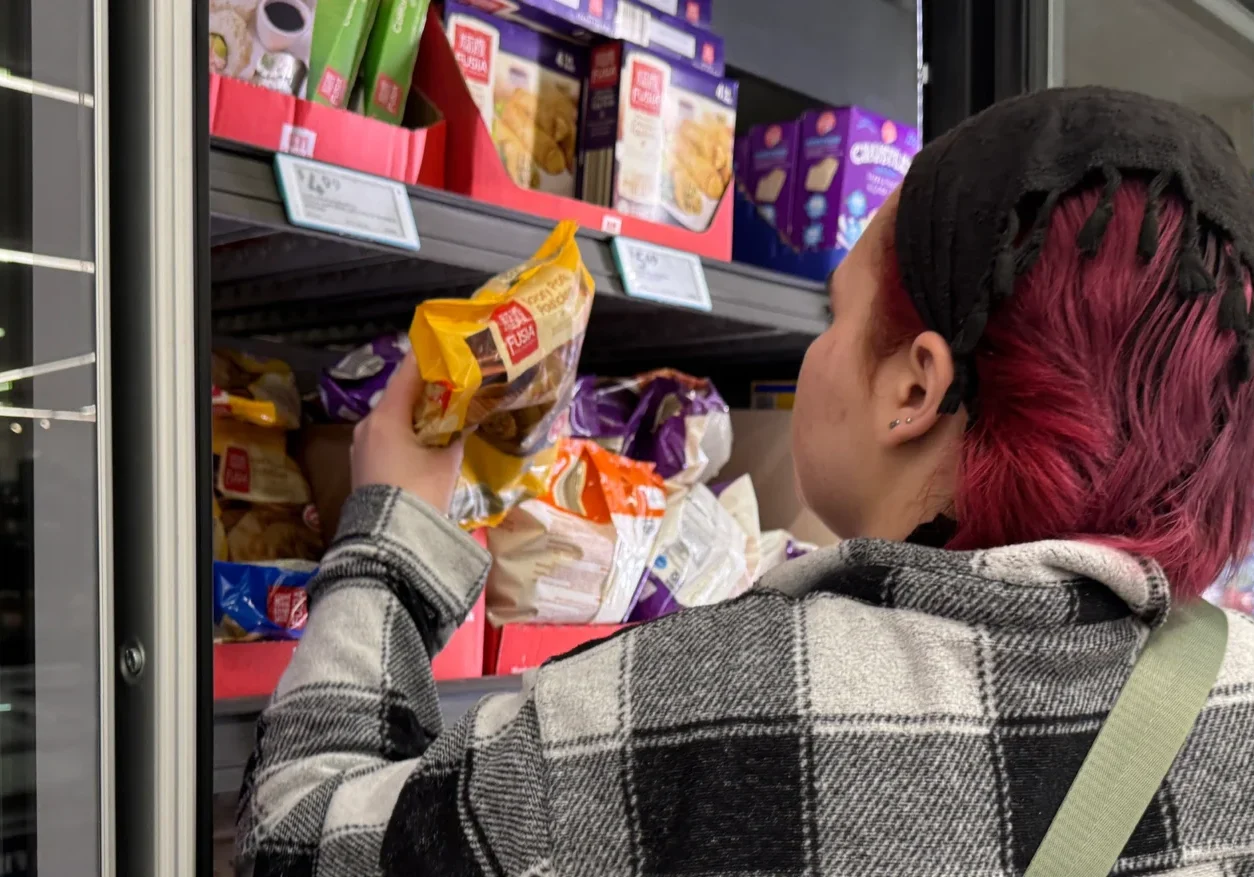 Individual choosing items in grocery store