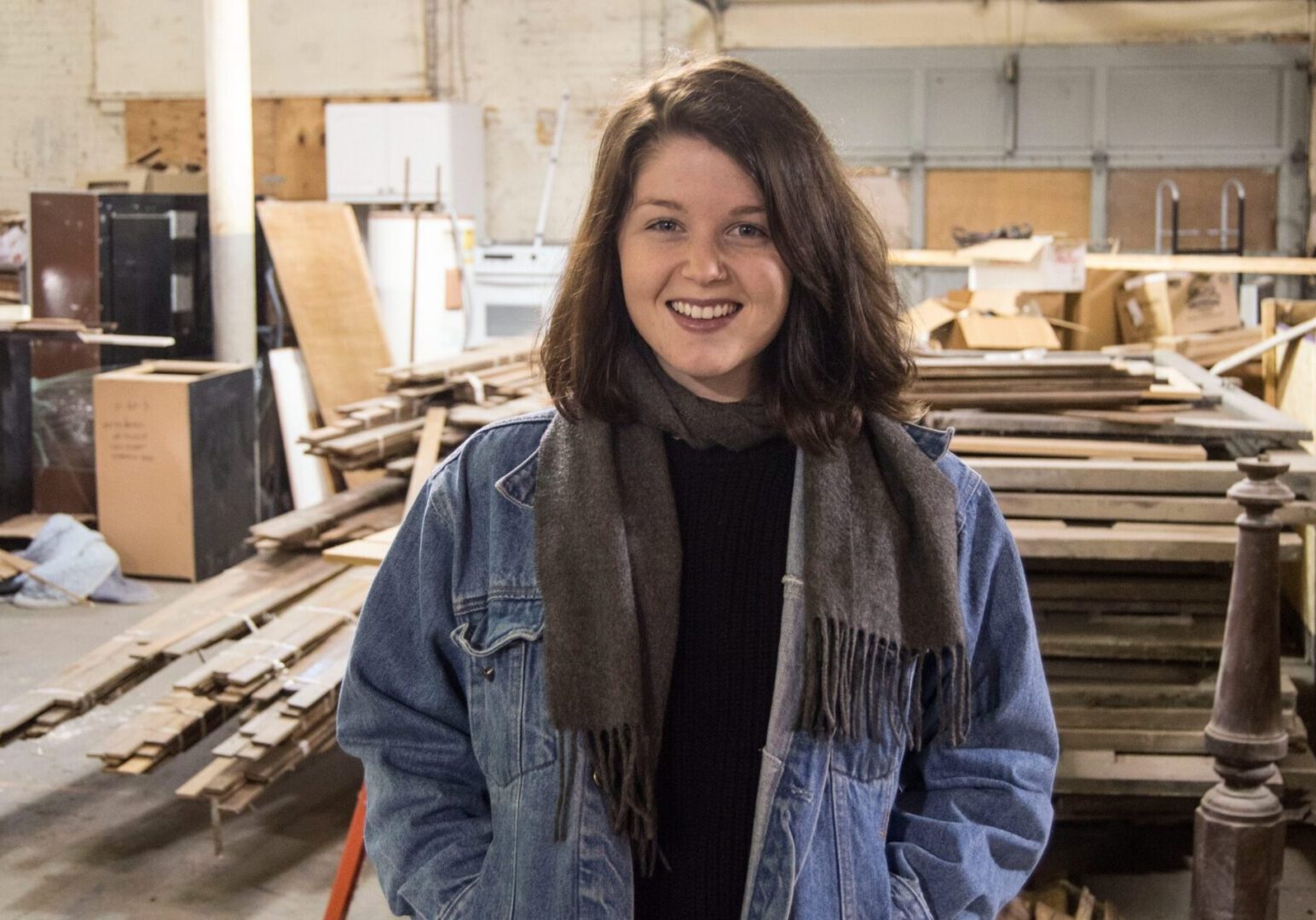 Woman smiling in warehouse