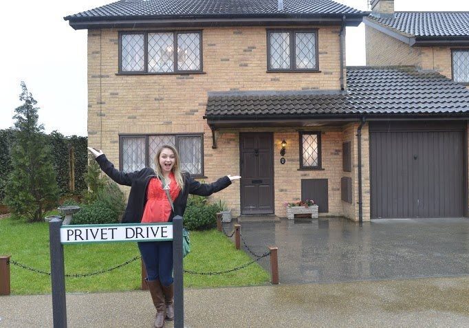 Woman posing at Privet Drive house