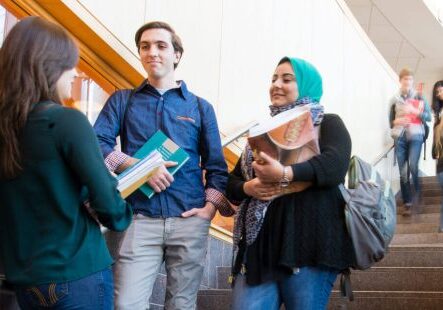 Friends having conversation in school stairway