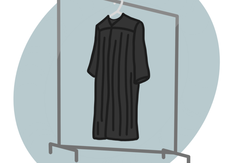 Black robe on clothing rack