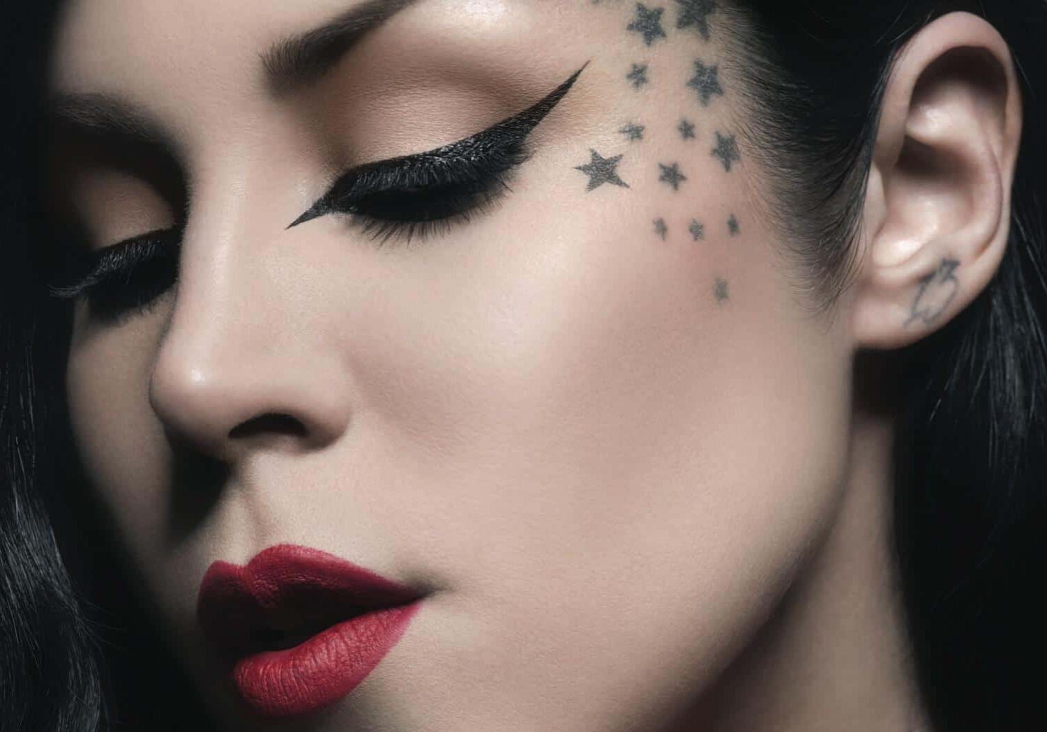 Elegant makeup with red lips and stars