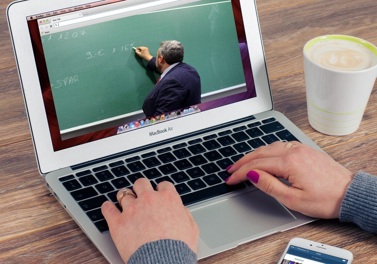Person watching educational video on laptop