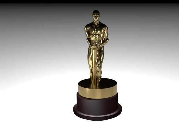 Golden statuette on a dark base