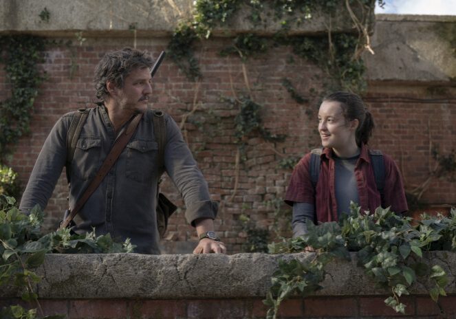 Smiling pair standing outdoors.
