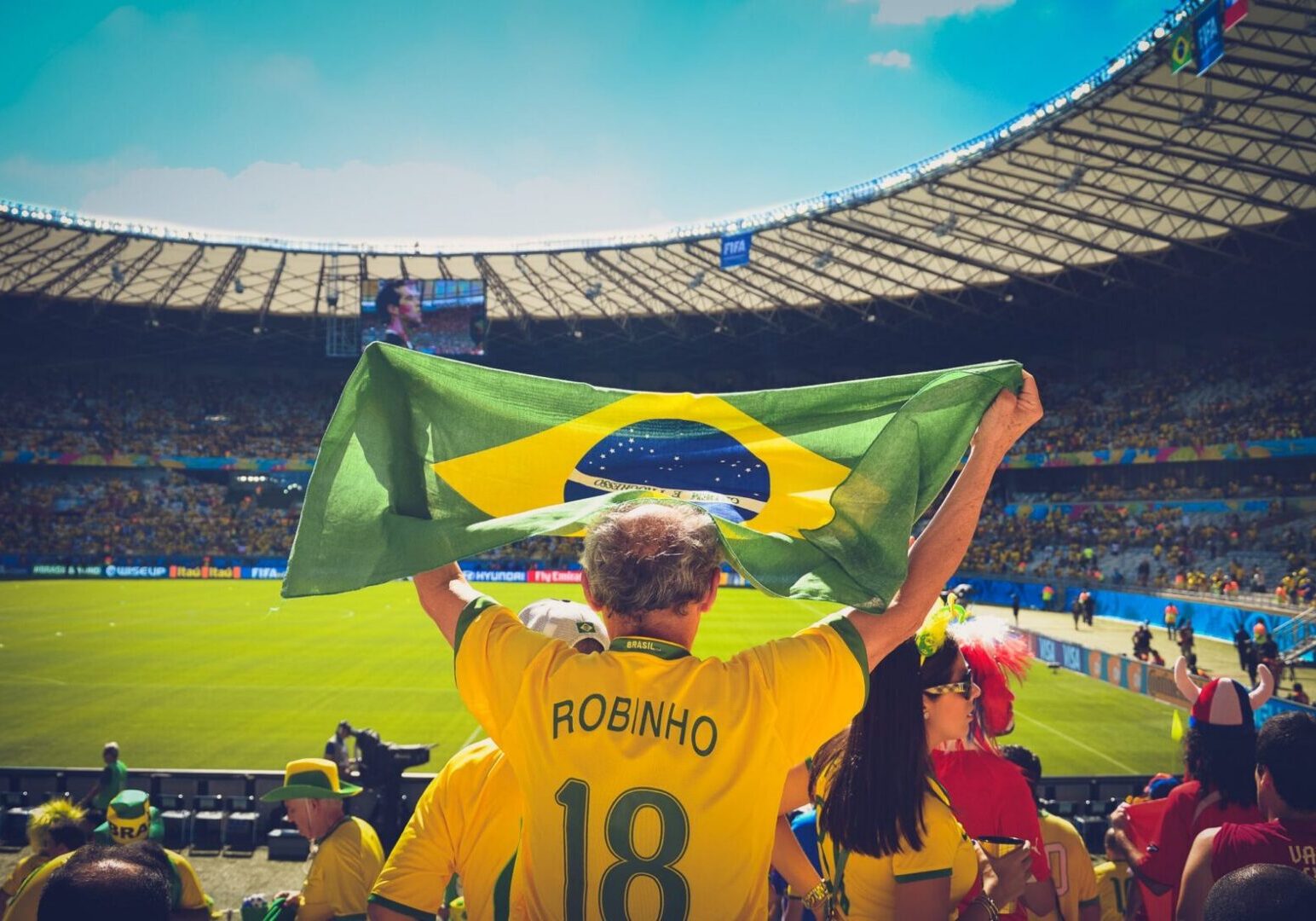 Man in yellow jersey at football game