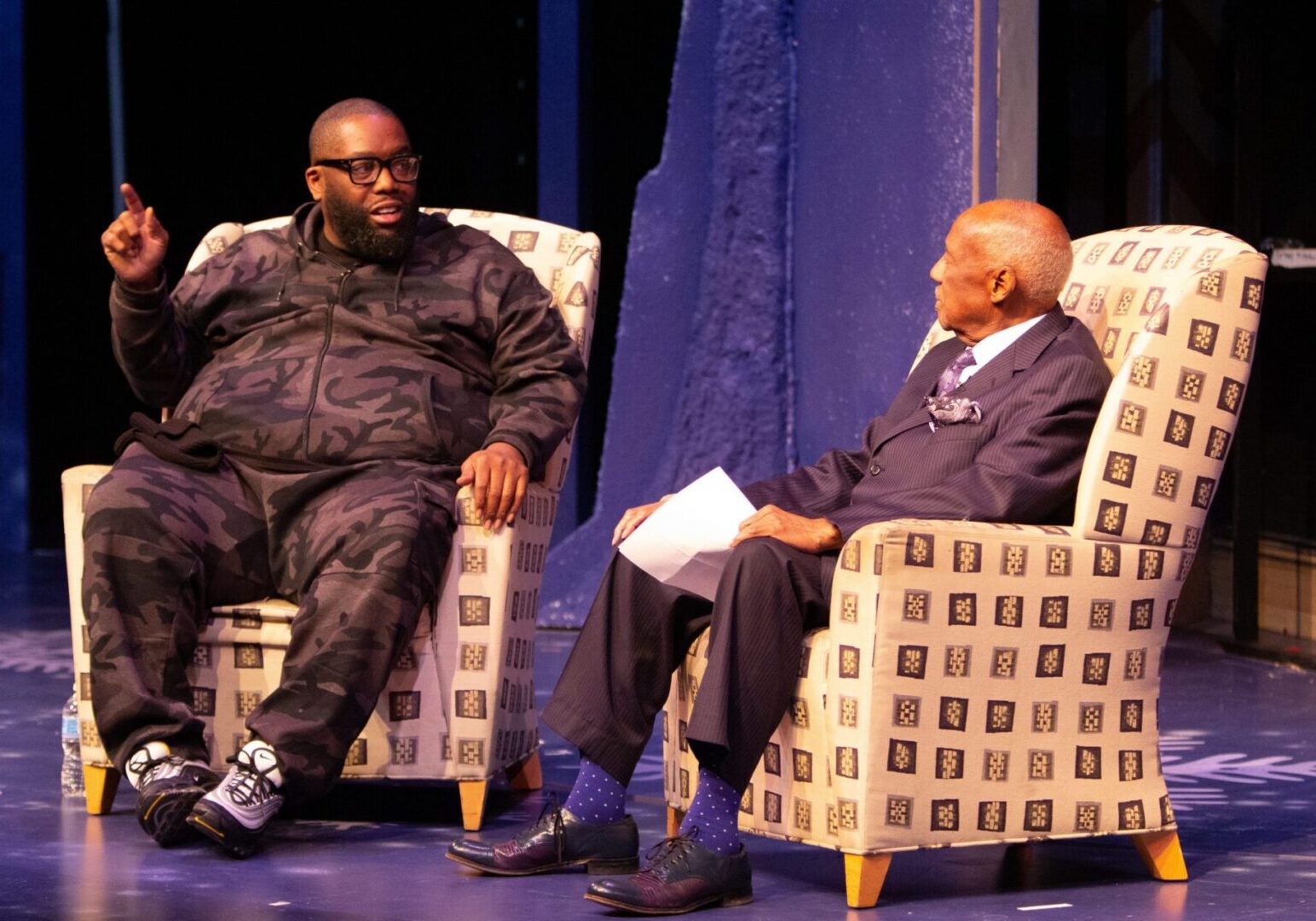 Engaging dialogue between two men on stage