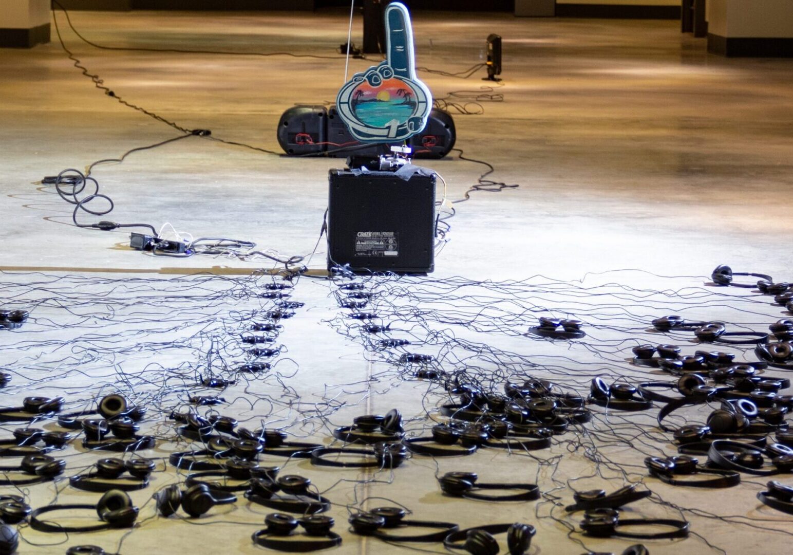 Art installation of tangled headphones and wires