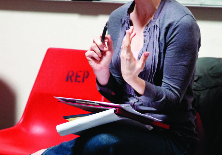 Person speaking in seated position
