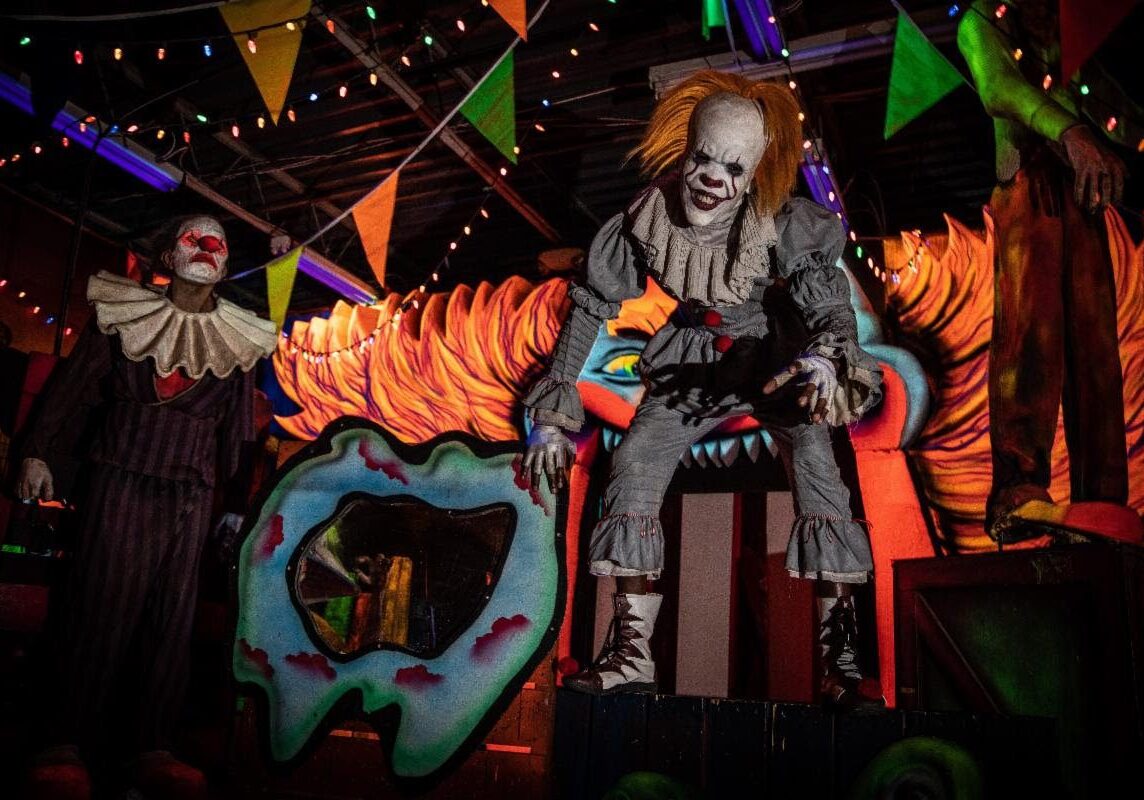 Spooky carnival scene with sinister clown