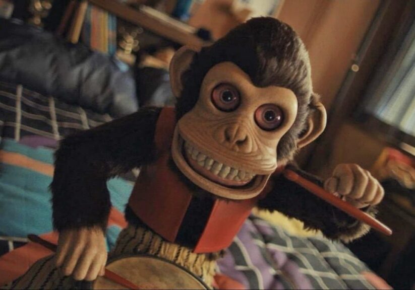 Creepy cymbal-banging monkey toy close-up