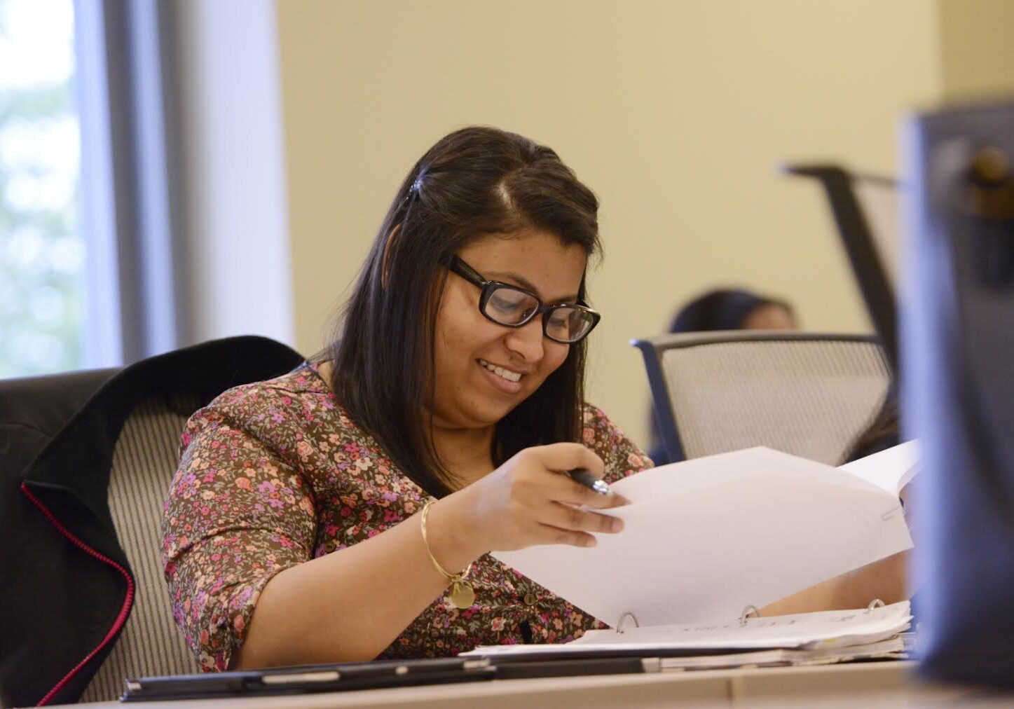 Woman reviewing documents at a desk