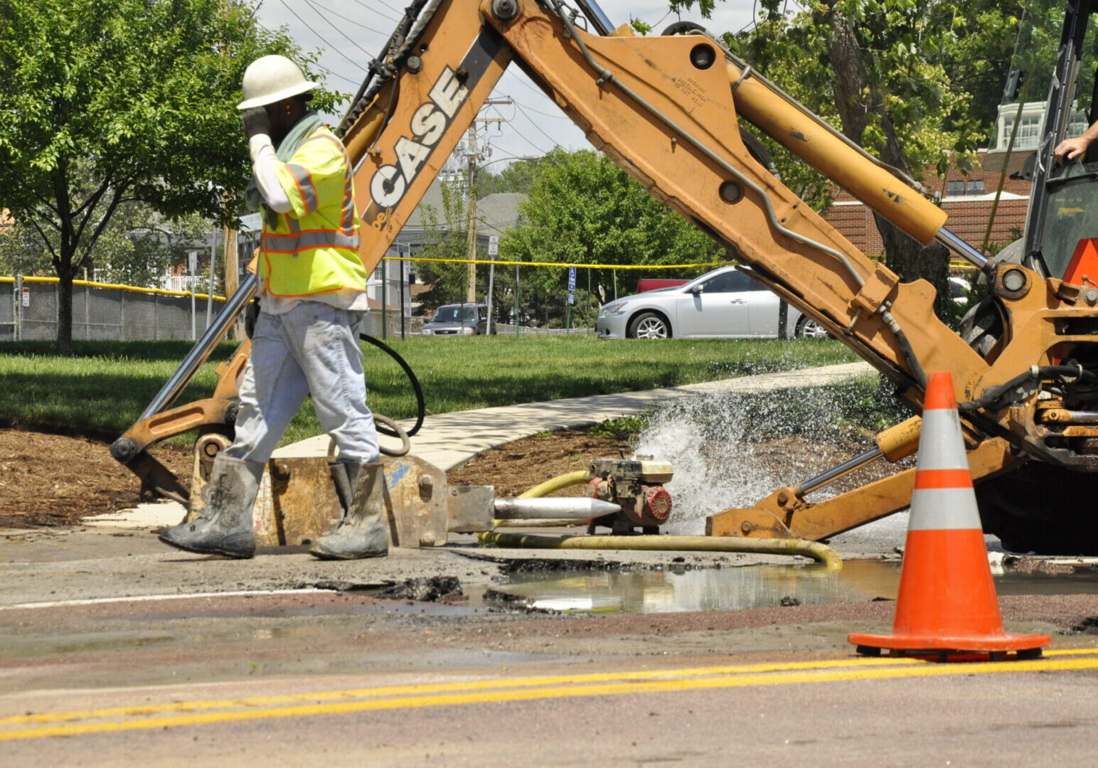 Road repair with machinery and water spray