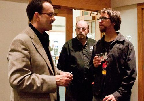 Casual discussion among three men