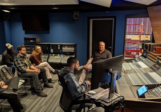 Audio engineers meeting in control room